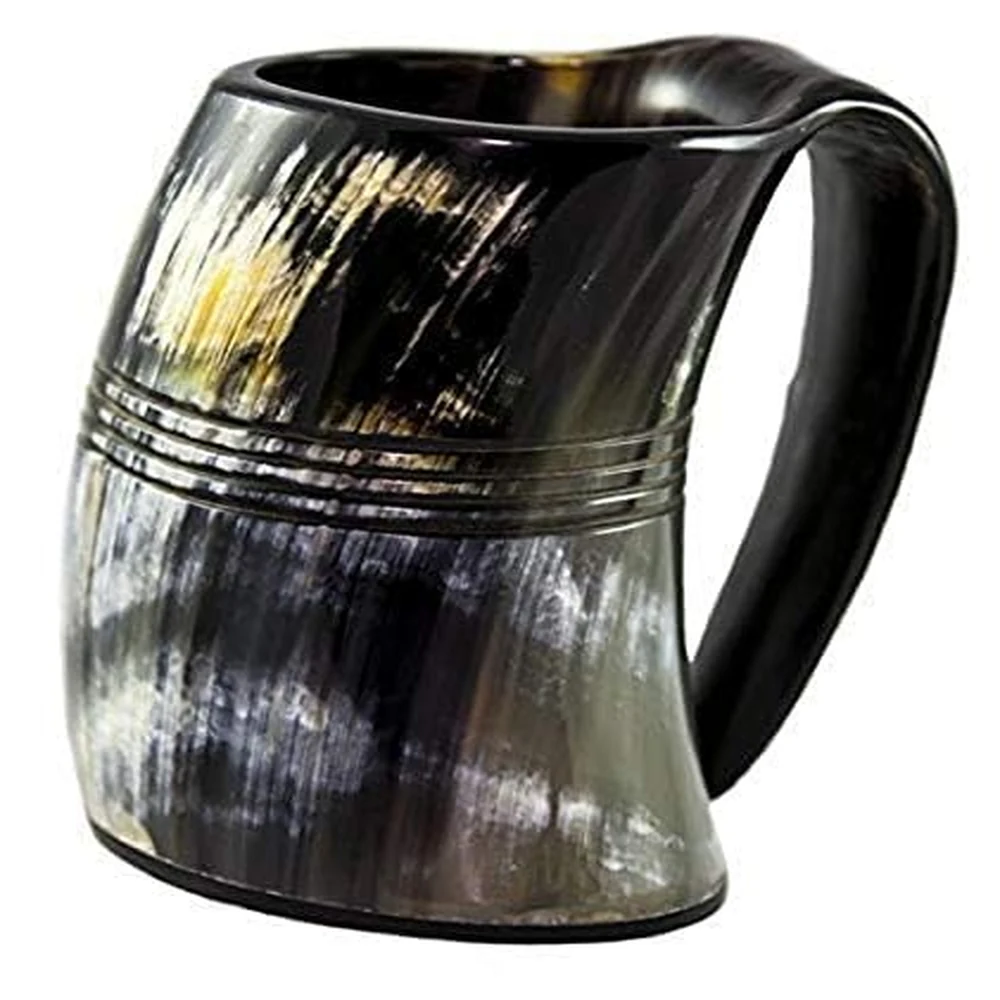 Natural ox horn beer mug filled with beverage Natural ox horn beer mug filled with beverage