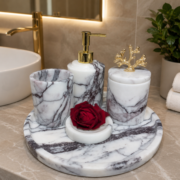 Luxury natural marble bathroom accessories set with gold accents including soap dispenser, tumbler, storage jar, soap dish, and marble tray.