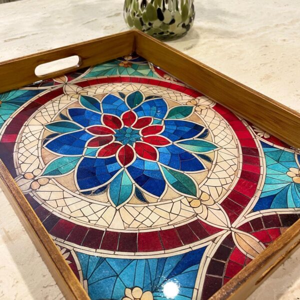Handcrafted rectangular wooden serving tray with colorful floral mosaic artwork.