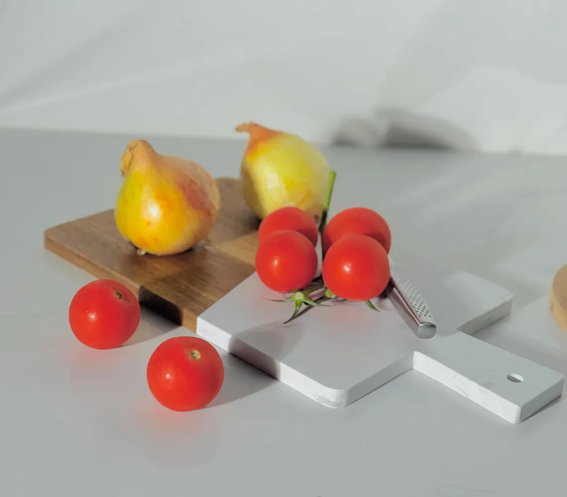 Handcrafted round wooden and white marble serving board with integrated handle. Handcrafted round wooden and white marble serving board with integrated handle.