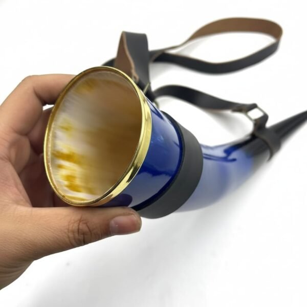 Side view of blue ceramic horn-shaped mug