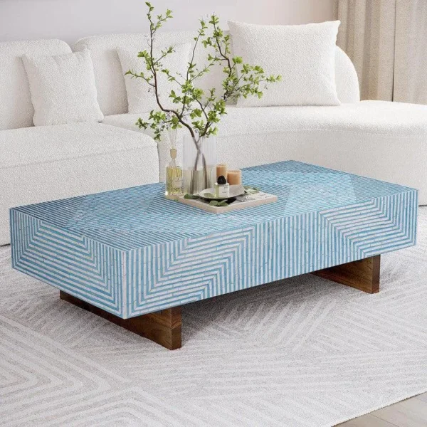Blue geometric bone inlay coffee table handcrafted with intricate linear inlay pattern in a luxury living room