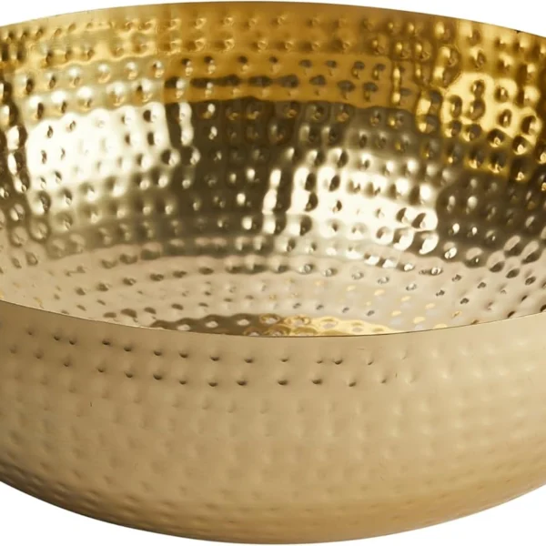 Close up of hammered gold metal bowl textured finish