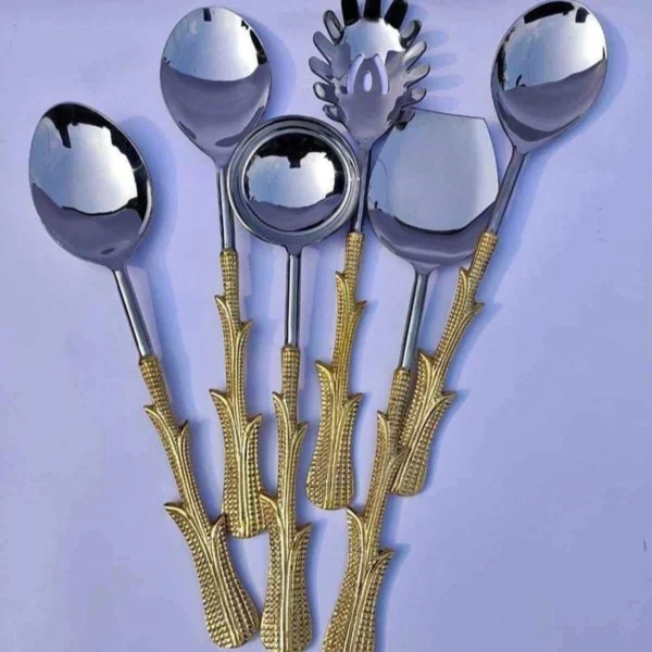 Luxury stainless steel serving spoon with ornate gold resin handle