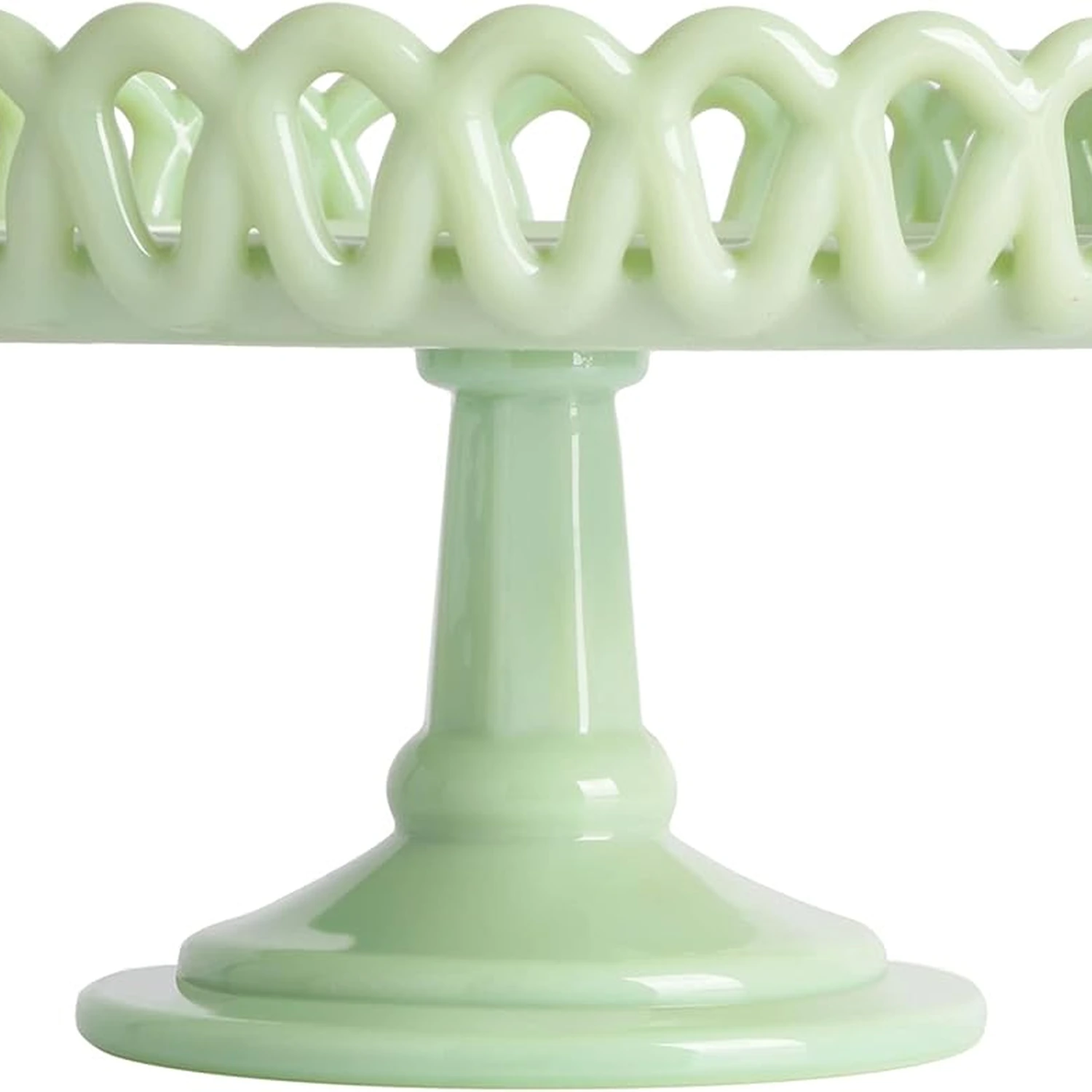light-green-pedestal-cake-stand.webp Close up of decorative openwork rim on light green cake stand