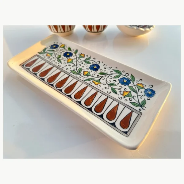 Floral ceramic soap dispenser with blue and green decorative pattern